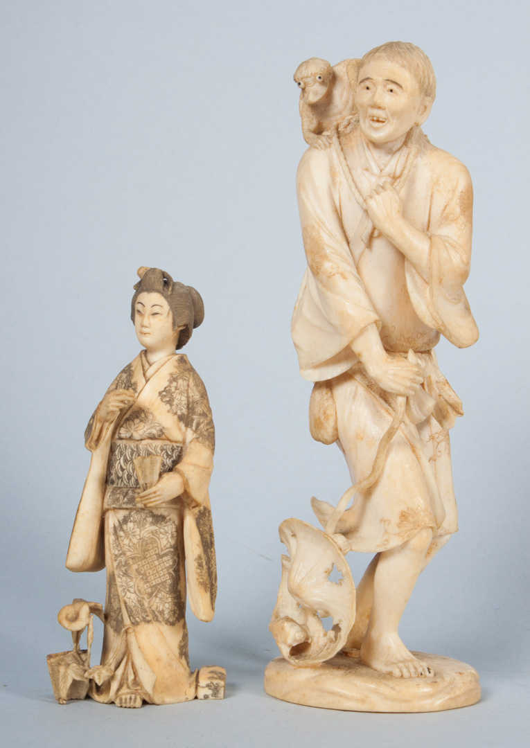 Appraisal: Two Japanese carved ivory figures tattered beggar with fanciful beast