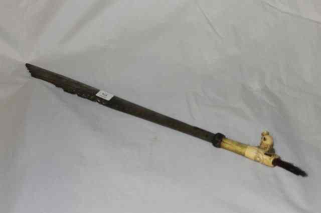 Appraisal: A SWORD possibly Tibetan with carved bone handle and inlaid