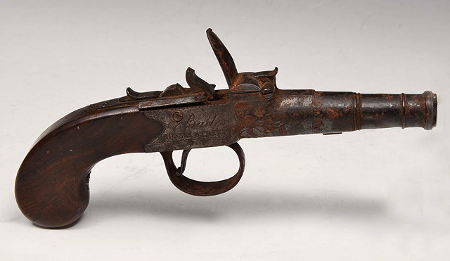 Appraisal: A TH CENTURY FLINTLOCK PISTOL with walnut stock and engraved