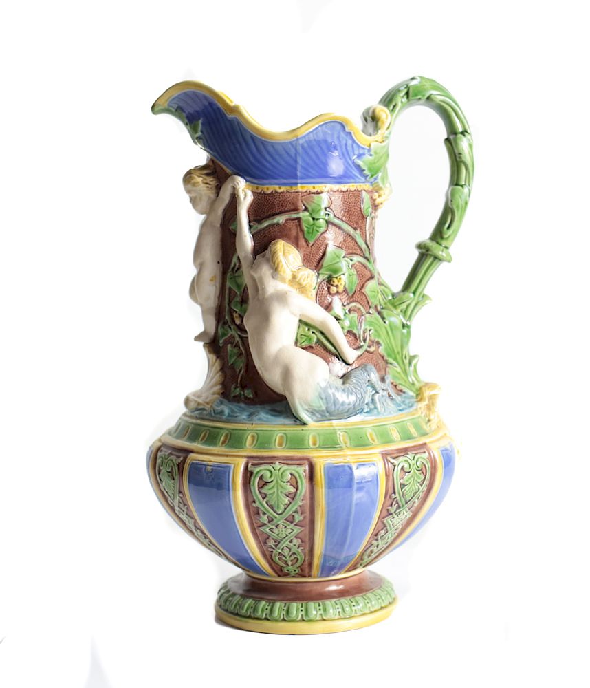 Appraisal: Minton Majolica Pitcher An elaborately decorated majolica pitcher by Minton