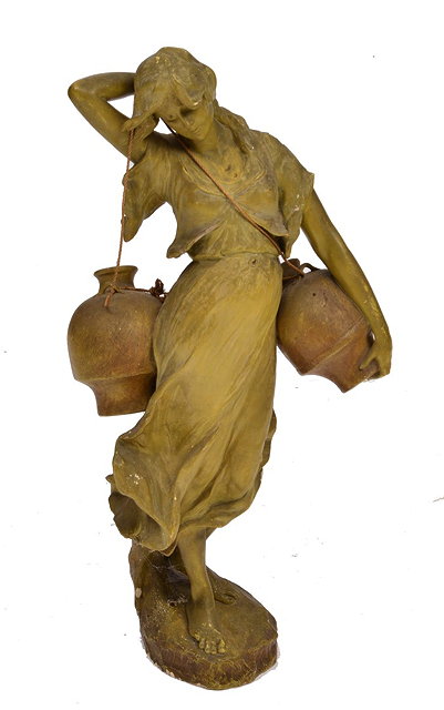 Appraisal: A VICTORIAN PLASTER FIGURE of a girl water carrier green