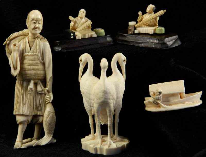 Appraisal: Group of Five Japanese Ivory Carvingsthe first an okimono of