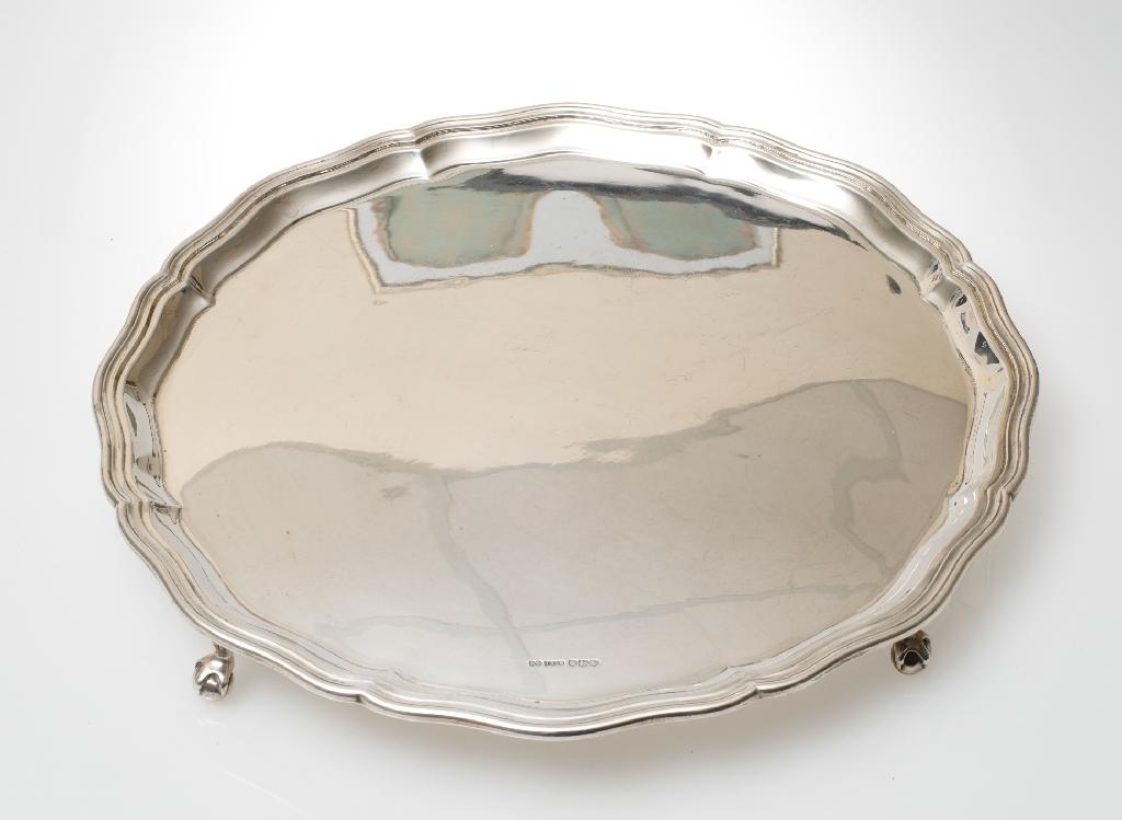 Appraisal: LARGE GEORGE VI SILVER SALVER IN th CENTURY STYLE SHEFFIELD