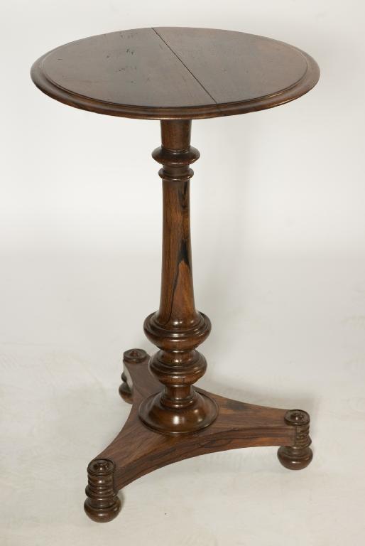 Appraisal: REGENCY ROSEWOOD OCCASIONAL TABLE the moulded circular top raised on