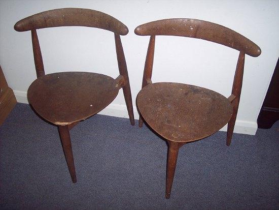 Appraisal: A pair of oak and plywood chairs designed by Hans