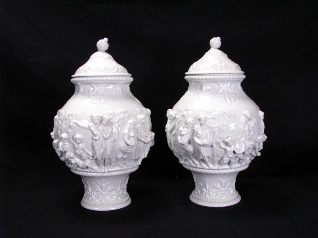 Appraisal: Pair of lidded Capodimonte urns glazed white porcelain tall depicting