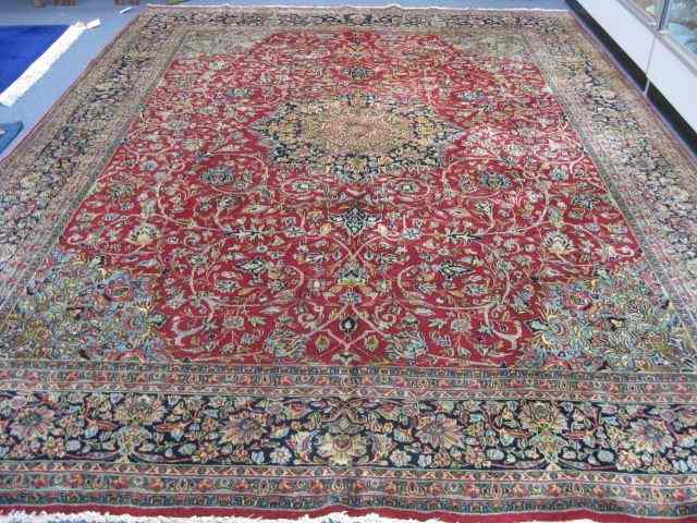 Appraisal: Kerman Handmade Persian Rug fancyflowering vine design on burgundy field