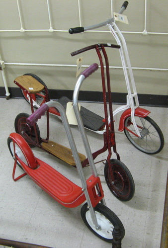 Appraisal: THREE VINTAGE TOY KICK SCOOTERS American c - 's various