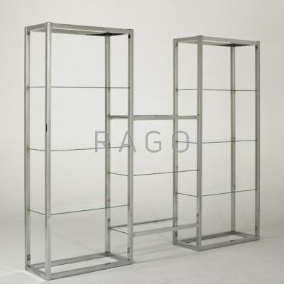 Appraisal: STYLE OF MILO BAUGHMAN Chrome etagere with glass shelves USA