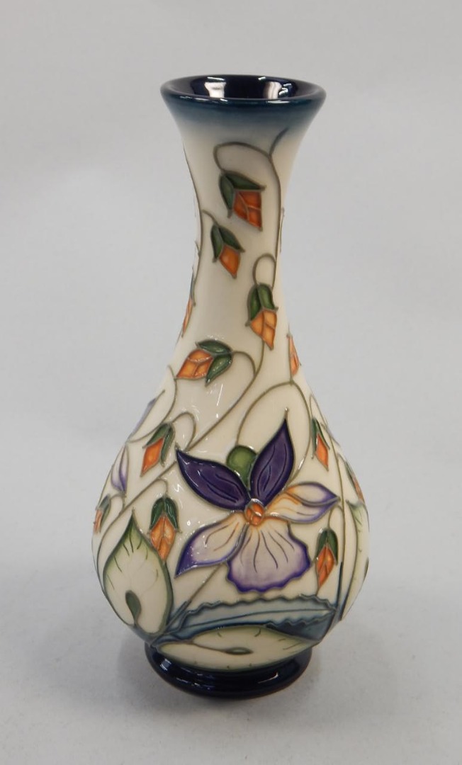 Appraisal: A modern Moorcroft bottle shaped vase decorated with flowers by