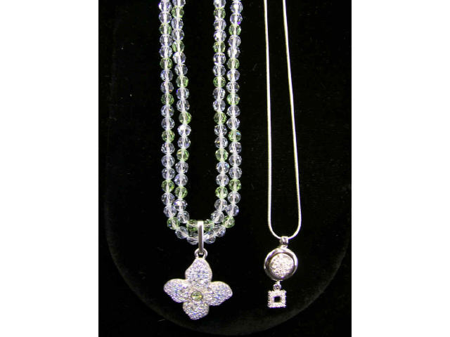 Appraisal: Two Swarovski necklaces including circle and diamond motif crystal pendant