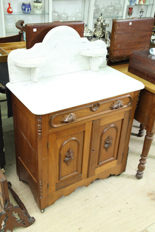 Appraisal: VICTORIAN WASHSTAND White marble top with gallery over one drawer