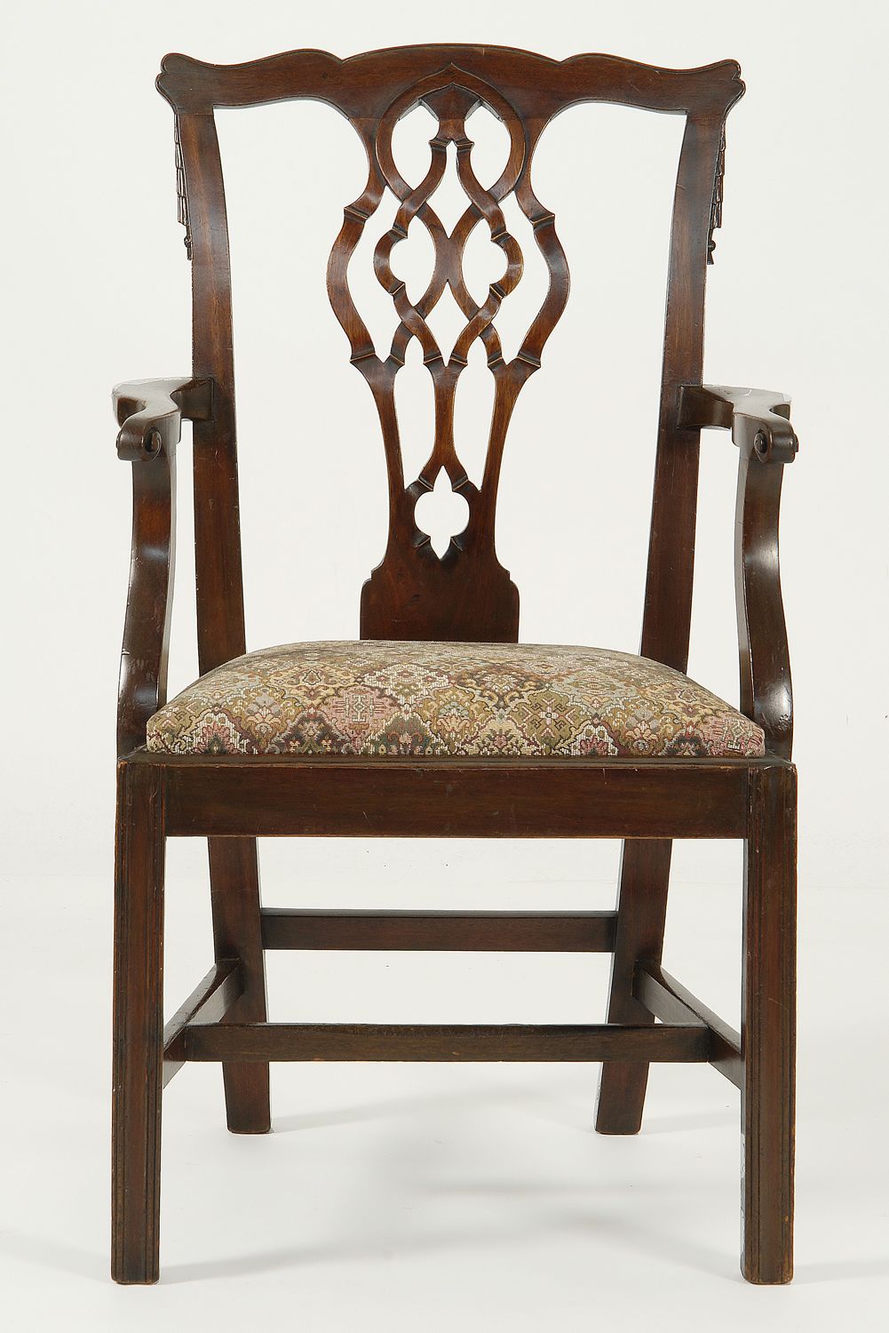 Appraisal: GEORGIAN-STYLE ARMCHAIR in mahogany with vertical pierced splat carved swag