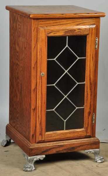 Appraisal: Oak Slot Machine Stand Description Metal feet and stained glass