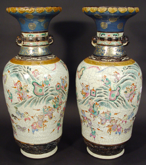 Appraisal: Large pair of oriental porcelain vases surmounted with animals' heads