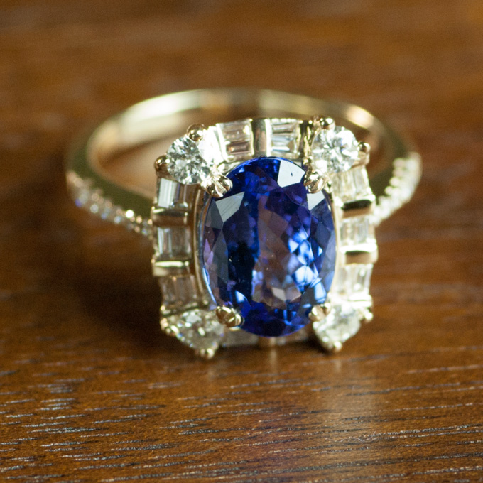 Appraisal: TANZANITE DIAMOND AND FOURTEEN KARAT GOLD RING with round-cut and