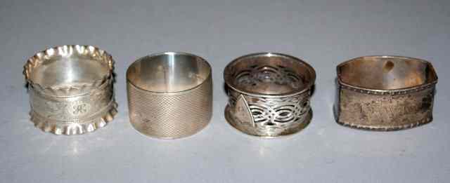 Appraisal: A SILVER NAPKIN RING with engine turned decoration by S