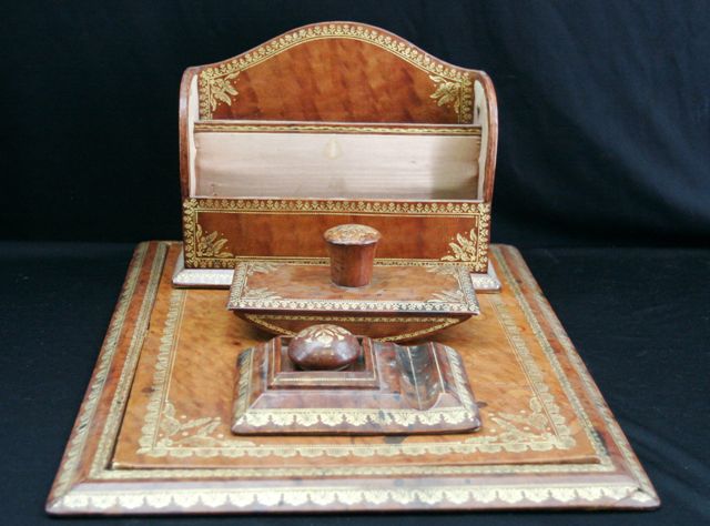 Appraisal: A tooled leather desk set including writing surface ink blotter