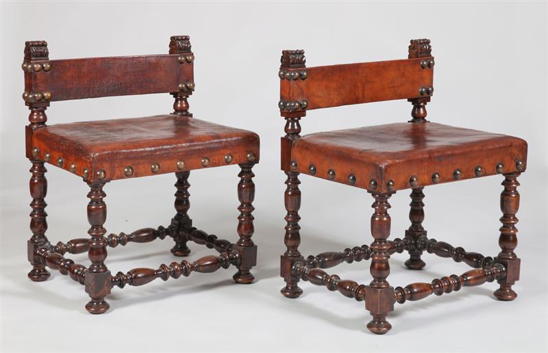 Appraisal: PAIR OF SPANISH BAROQUE STYLE STAINED WALNUT AND LEATHER HALL