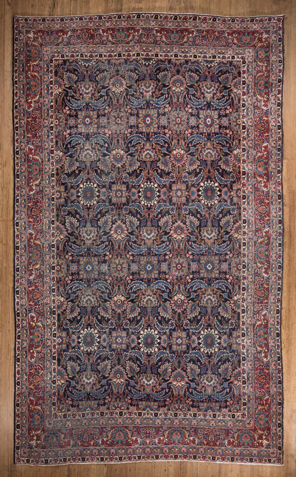 Appraisal: Persian Carpet blue ground red border repeating design ft in