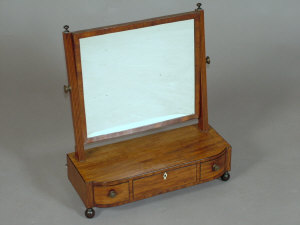 Appraisal: A Regency mahogany and ebony inlaid dressing table mirror with