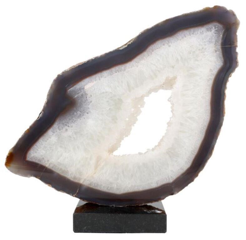 Appraisal: Agate slice Solomon Islands mounted on black granite base specimen