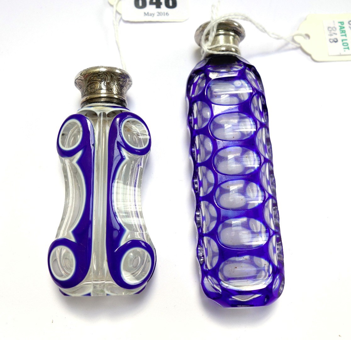 Appraisal: A Victorian blue flashed cut glass scent bottle with white