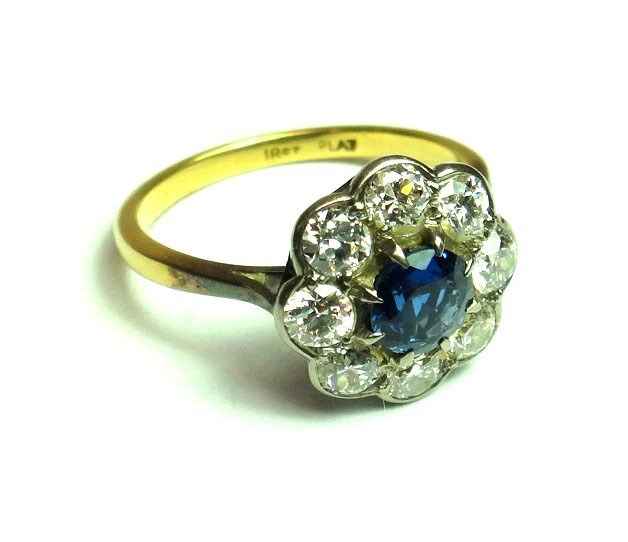 Appraisal: A gold and platinum sapphire and diamond set nine stone