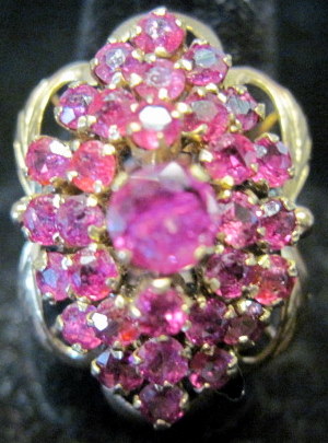 Appraisal: karat yellow gold pink sapphire cluster ringFlower form with prong