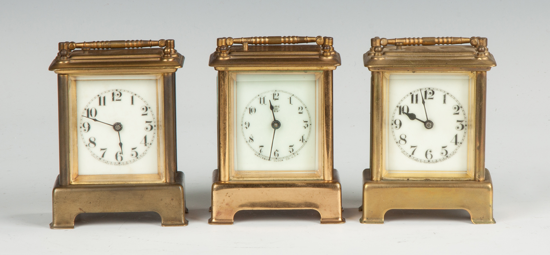 Appraisal: Three Waterbury Carriage Clocks Brass cases beveled glass porcelain dials