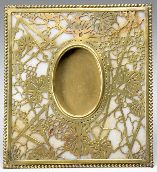 Appraisal: TIFFANY STUDIOS Table-top picture frame in the Grapevine pattern gold