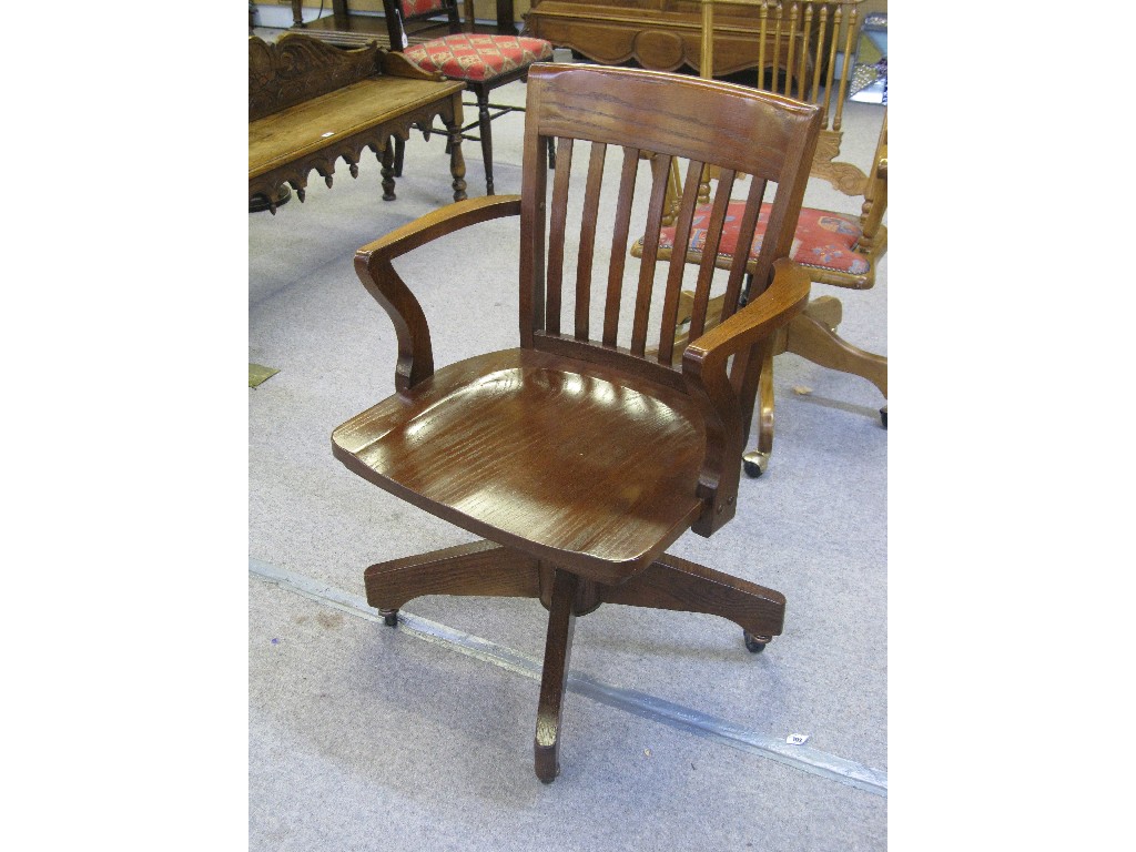 Appraisal: Oak slatback swivel chair