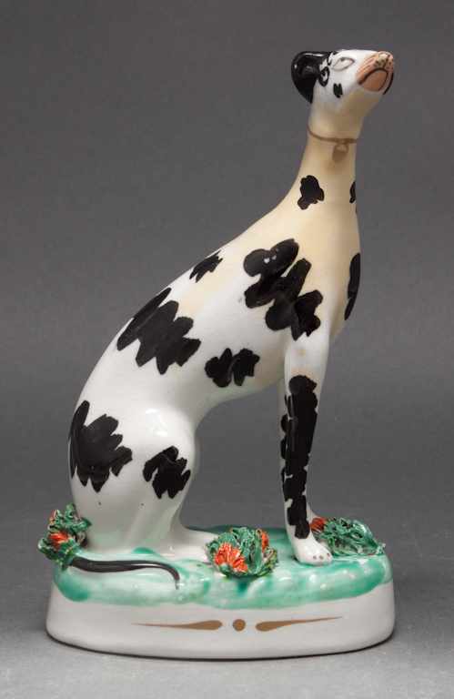 Appraisal: Staffordshire painted earthenware whippet figure in H Estimate - broken