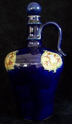 Appraisal: A Royal Doulton ewer and stopper decorated thistles on a