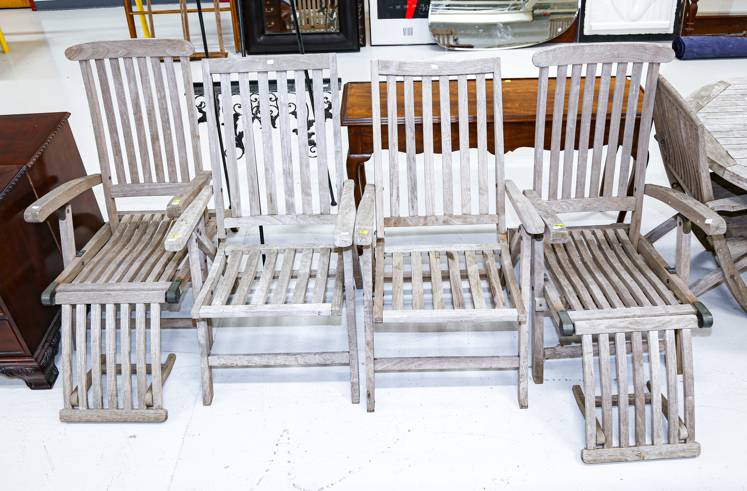 Appraisal: FOUR OUTDOOR PATIO TEAK RECLINING CHAIRS in W