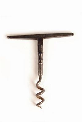 Appraisal: An Irish steel corkscrew with folding 'T' handle