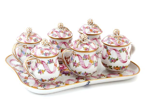 Appraisal: A Dresden porcelain set of six pots-de-creme with stand height