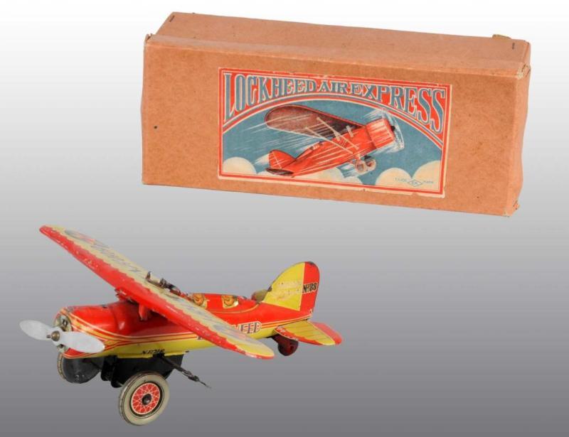 Appraisal: Tin Lockheed Airplane Wind-Up Toy Description Japanese Pre-war Working Original