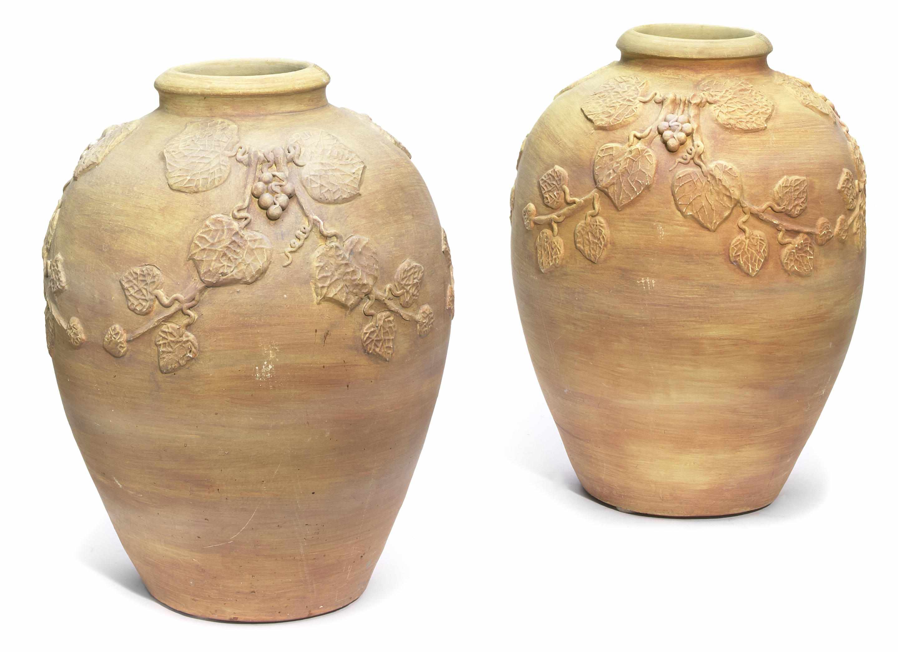 Appraisal: A pair of paint decorated earthenware vases height in cm