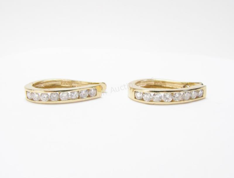 Appraisal: A pair of K yellow gold diamond hoop earrings containing