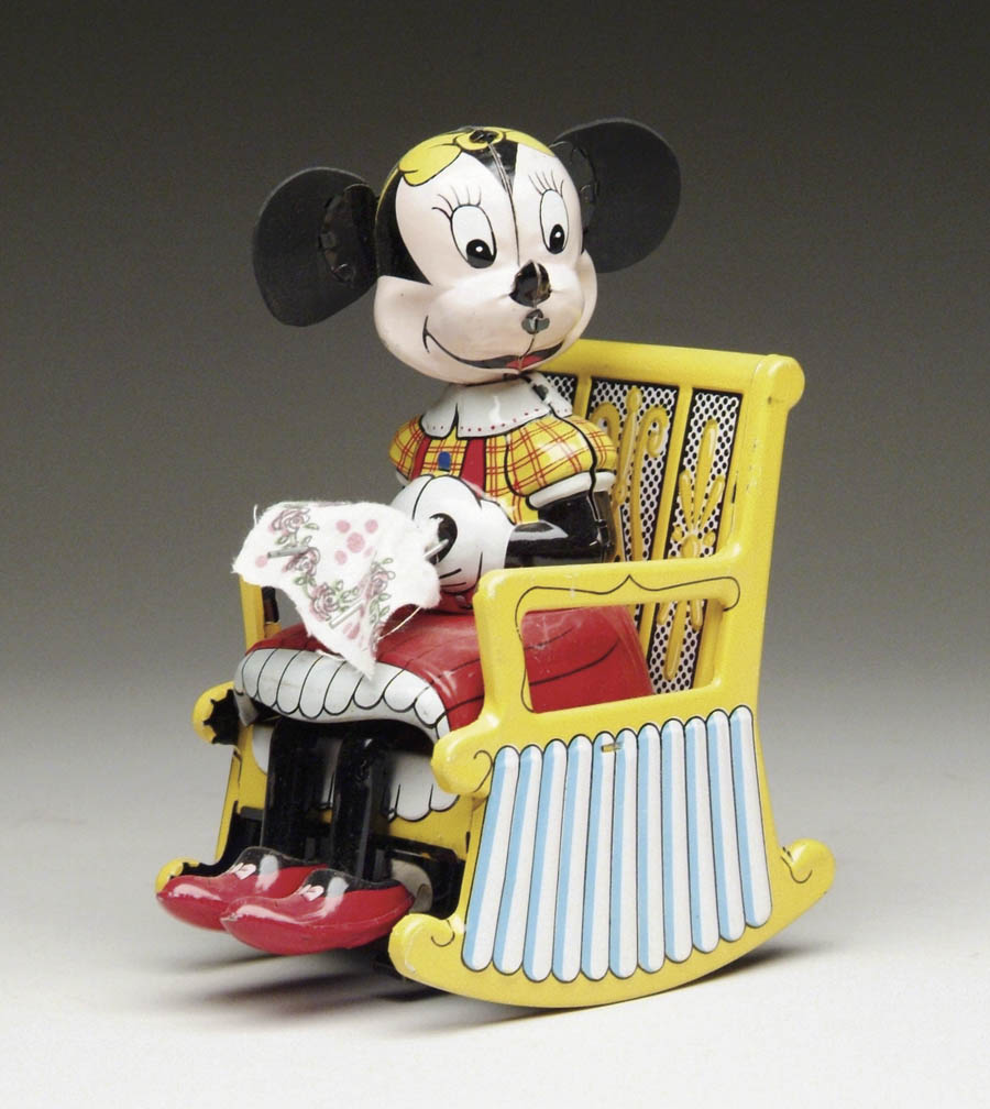 Appraisal: WIND-UP KNITTING MINNIE MOUSE BY LINEMAR Minnie Mouse sits on