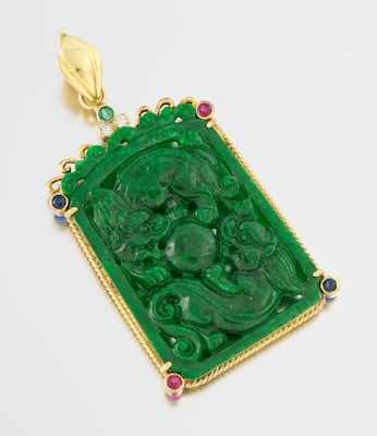 Appraisal: A Carved Jadeite Pendant with Gemstones in k Gold Frame