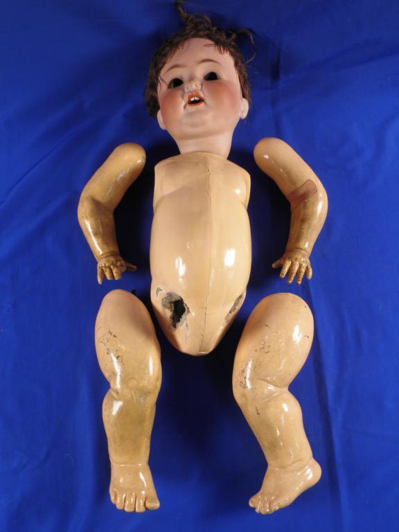 Appraisal: A Heubach and Koppelsdorf bisque headed doll with brown hair