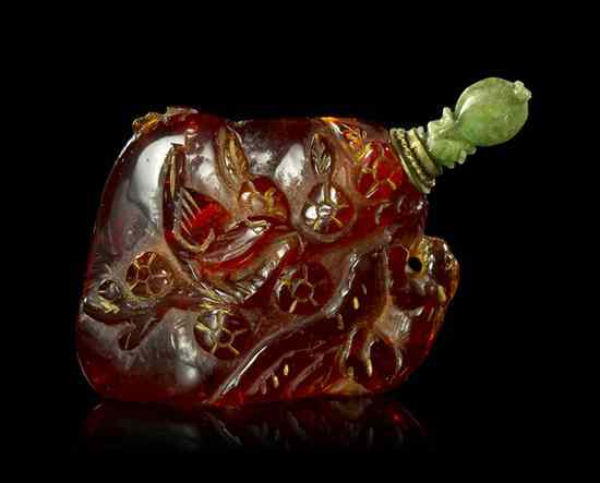 Appraisal: A Carved Amber Pebble Form Snuff Bottle having decoration of