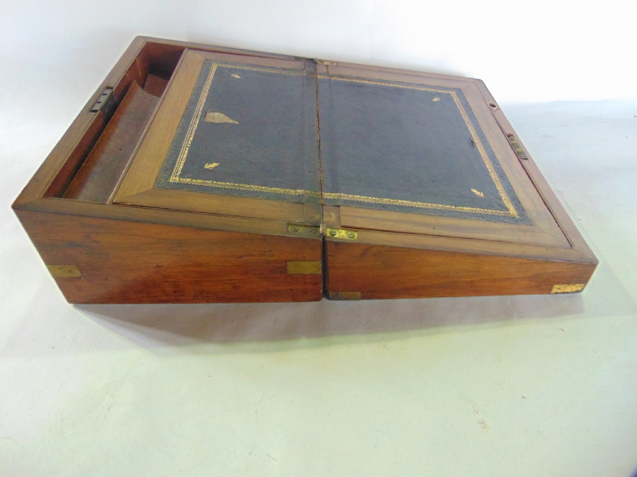 Appraisal: A th century mahogany veneered writing slope with brass capped