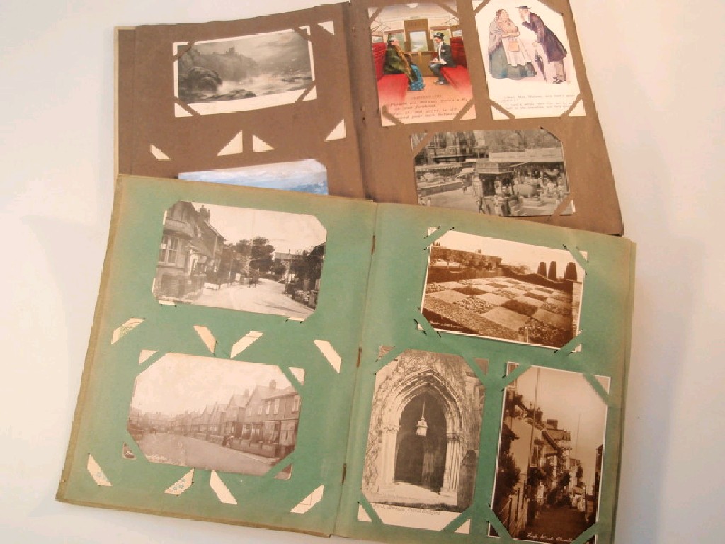 Appraisal: Approximately early thC assorted postcards contained in two albums