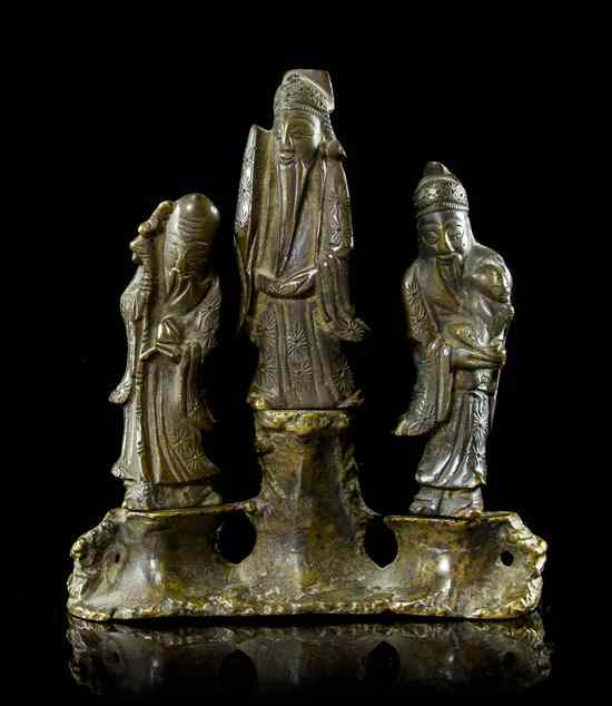 Appraisal: A Chinese Bronze Figural Group depicting three standing sages raised