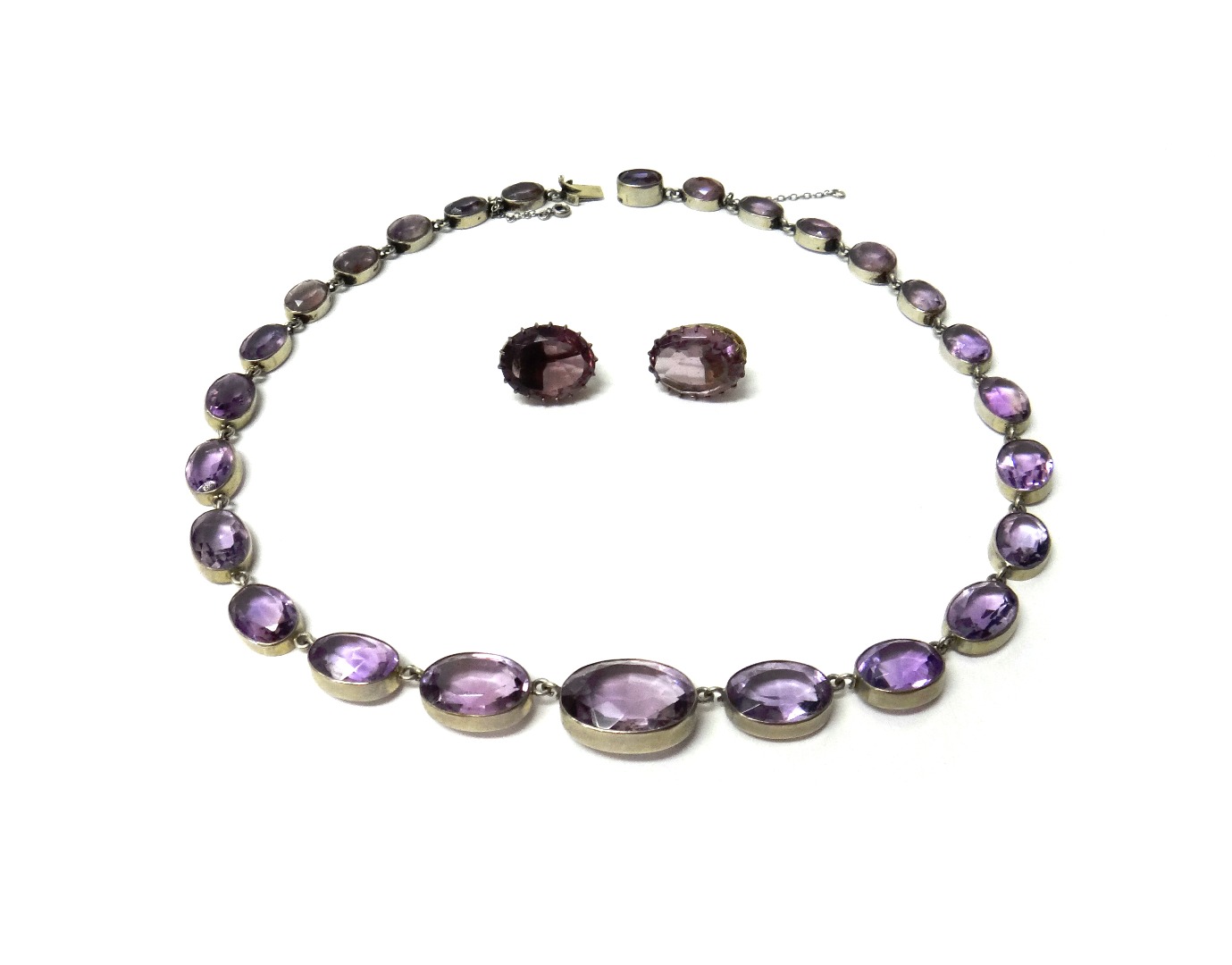 Appraisal: An amethyst necklace collet set with a row of oval