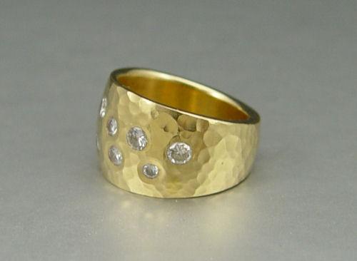 Appraisal: HAMMERED K DIAMOND STUDDED BAND RING K yellow gold band