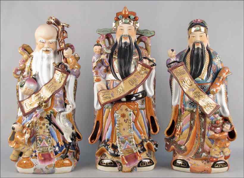 Appraisal: SET OF THREE CHINESE GILT AND PAINTED PORCELAIN SCHOLAR FIGURES